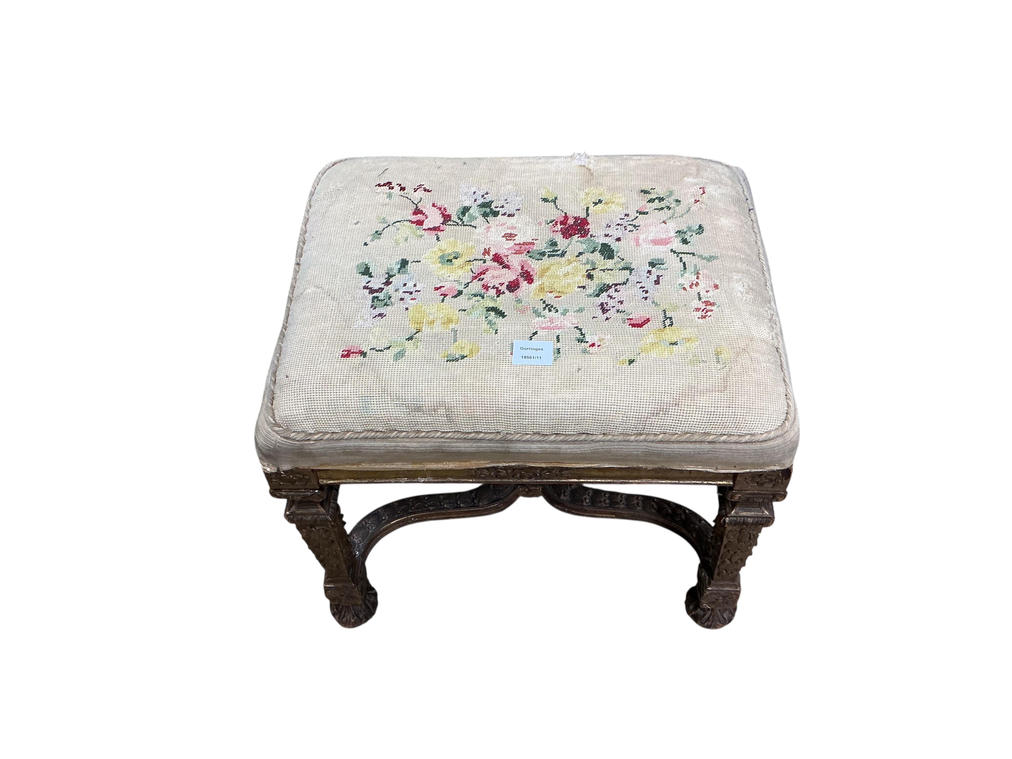 A 19th century carved giltwood dressing stool with shaped 'X' stretcher, width 56cm, depth 43cm, height 49cm